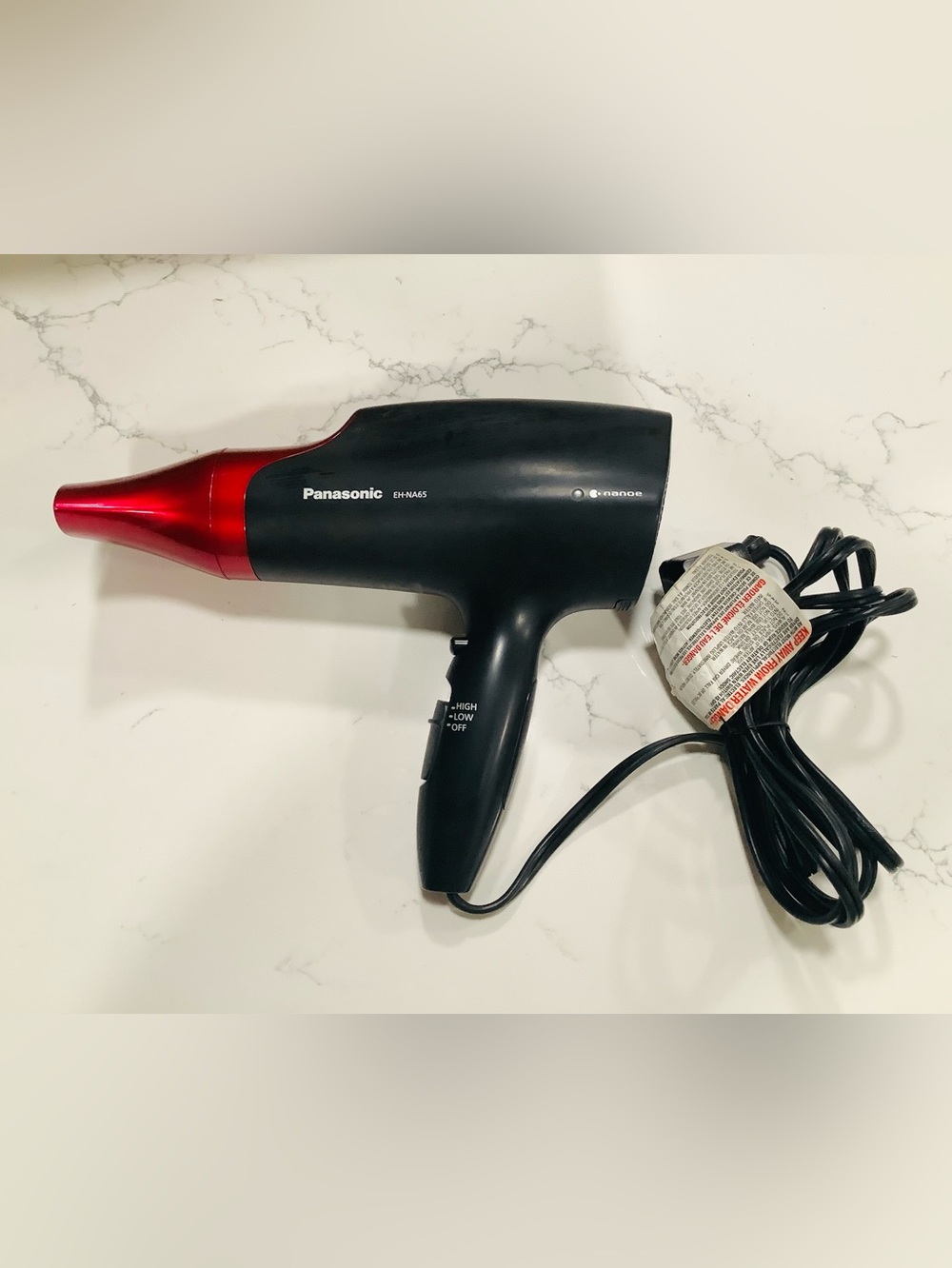 Panasonic EH-NA65 Nanoe Hair Dryer in red and black.